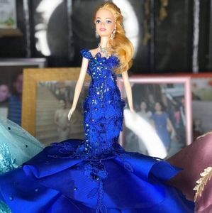 Doll with custom gown from a designer